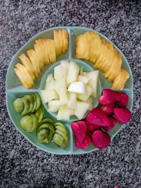 istock Plate with assorted fruits to serve as dessert 2117915175
