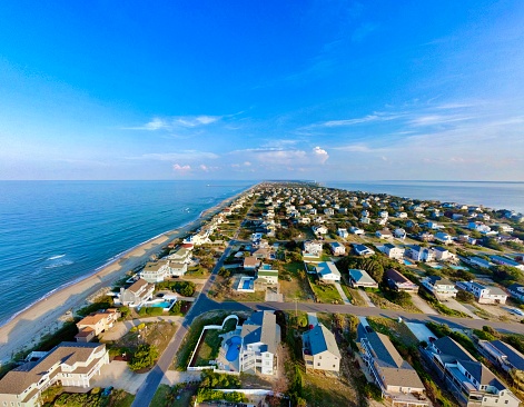 The sun setting along the bay to the right as I take a stunning aerial photo of the true beauty of the OBX.