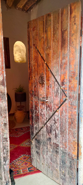 a wooden door at the entrance to a traditional house in the village Dechra Hamra, commune of El Kantara. Biskra. Algeria