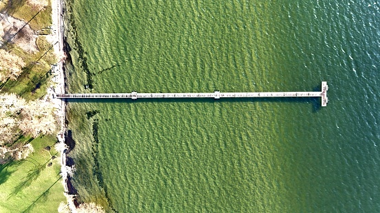 Drone photo of a pier on a lake side