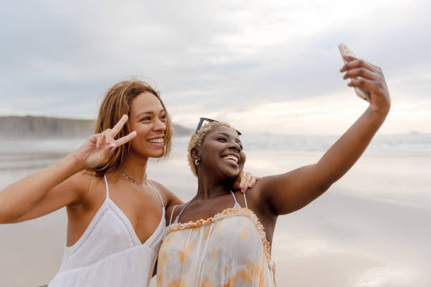 istock Two friends on the beach 2117995981