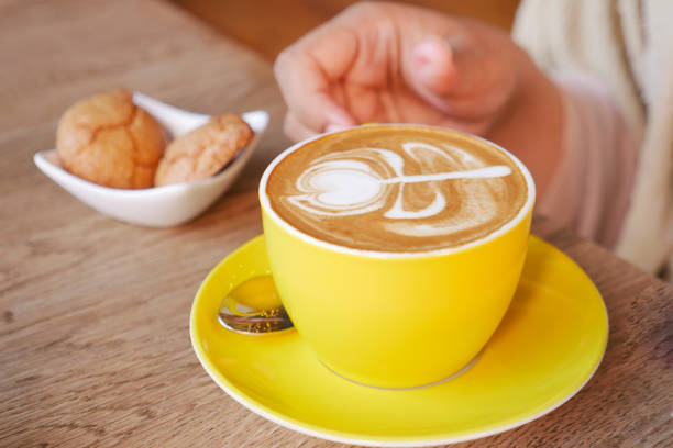 women holding a coffee cup .