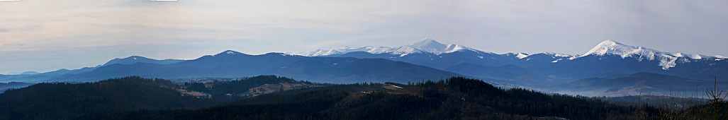 panoramic beautiful view of snowy peaks in the morning