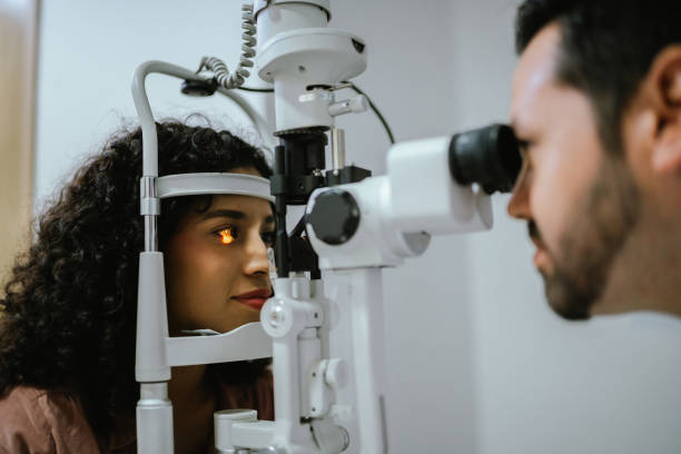 istock Young woman doing optical exam at medical clinic 2118024279