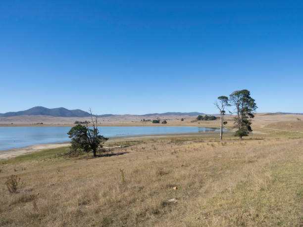 istock Lake surrounded by dry hills and grass in summer 2118026956