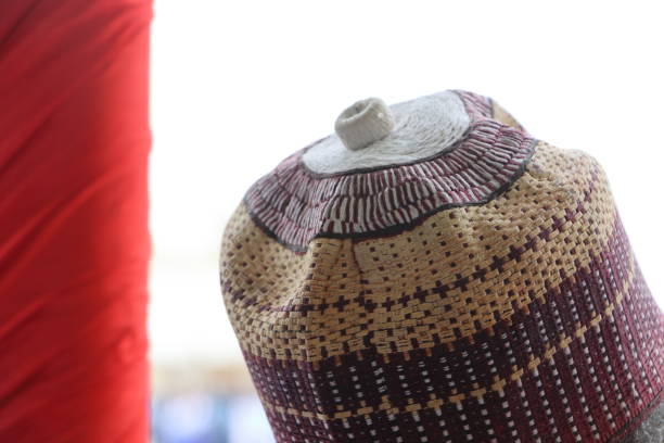 Horizontal shot of Romanian male folk hats, one larger, and one smaller, part of traditional costume, and national identity pride and heritage.