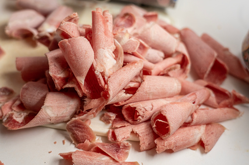 Pile of frozen meat cut into very thin slices