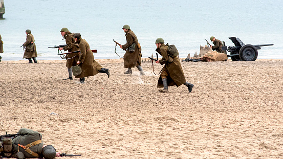 A Group of U.S. Soldier look for an enemy that fired on their position.
