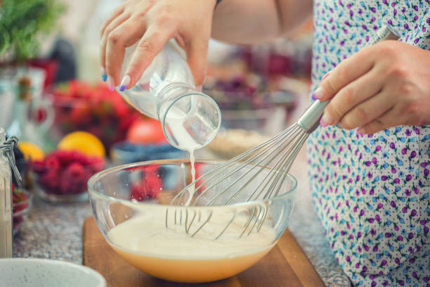 istock Woman Preparing Pancakes 2118096683