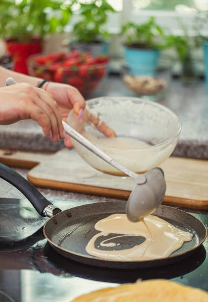istock Woman Preparing Crepes 2118097218