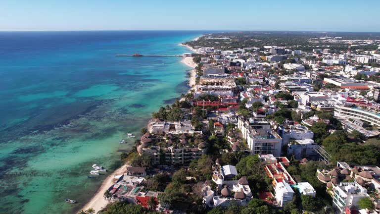 Playa Del Carmen, Mexico. Cinematic Drone Shot of CItyscape and Buildings by Caribbean Sea