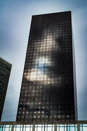A photo shows the reflection of the sun on the facade of a  building in La Defense business district, near Paris, on March 27, 2024.