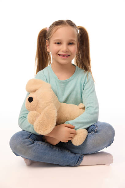 istock Adorable girl with teddy bear on white background 2118141965