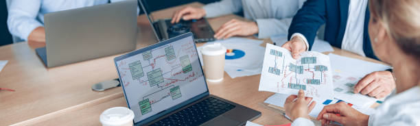 istock Focused business people are using gadgets and talking during the conference in office 2118167416