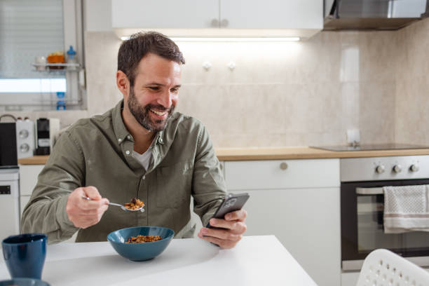 istock Mid adult man enjoying a morning routine at home 2118171092