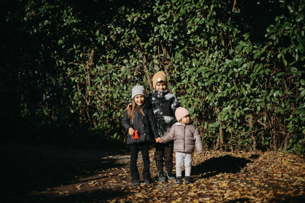 Children exploring a forest together.