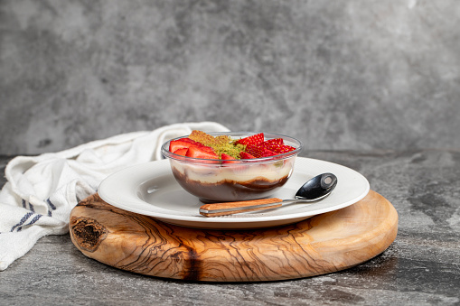 Strawberry magnolia dessert. Strawberry pudding dessert on wooden serving board. Famous dishes of Turkish cuisine