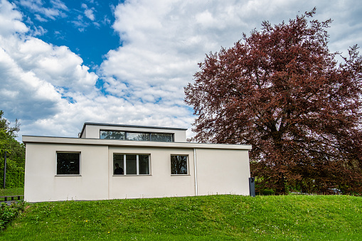 Weimar, Germany - May 12, 2023: Haus am Horn building in Weimar, Germany with grass lawn. Haus am Horn is the only truly Bauhaus building in Weimar.