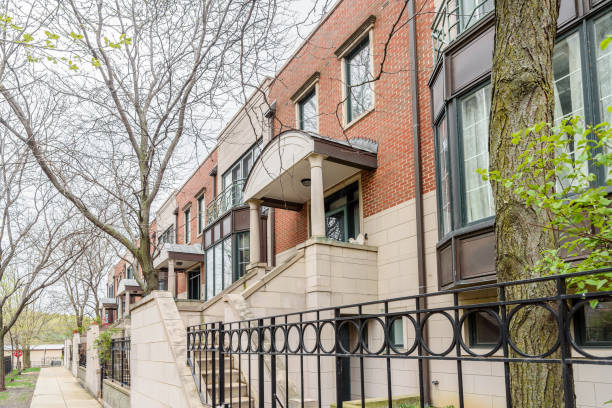 istock Modern red brick row houses in a housing development on a rainy spring day 2118264143