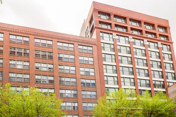 istock High rise renovated apartment building under cloudy sky in spring 2118268241