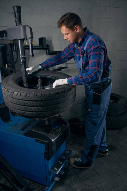 istock Male doing wheel examination, identification of broken parts 2118268247