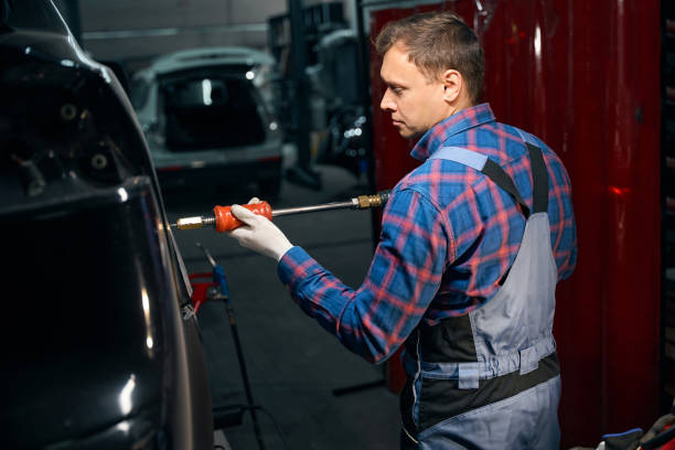 istock Male working with front fender in tire fitting 2118278633