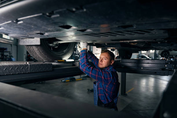 istock Professional mechanic examine car, working in tire fitting 2118278635