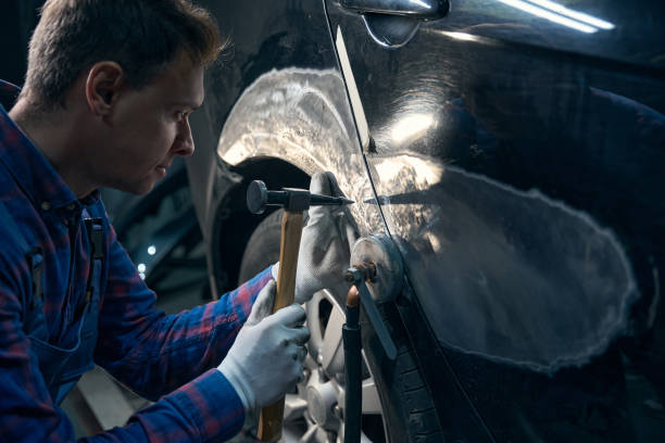istock Skilled male working with front fender with instrument 2118278648