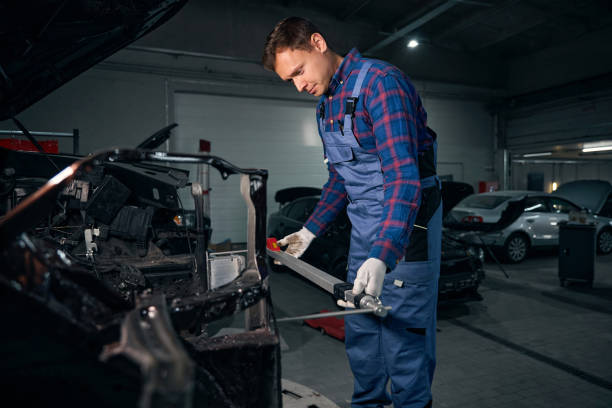istock Man installing ruler on body of car 2118278657