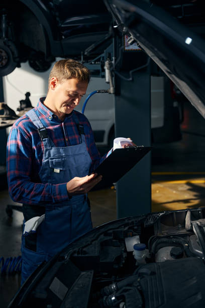 istock Man performing work with transport in tire fitting 2118289036