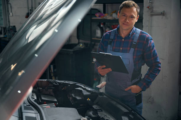 istock Mechanic performing work with transport in tire fitting 2118289047