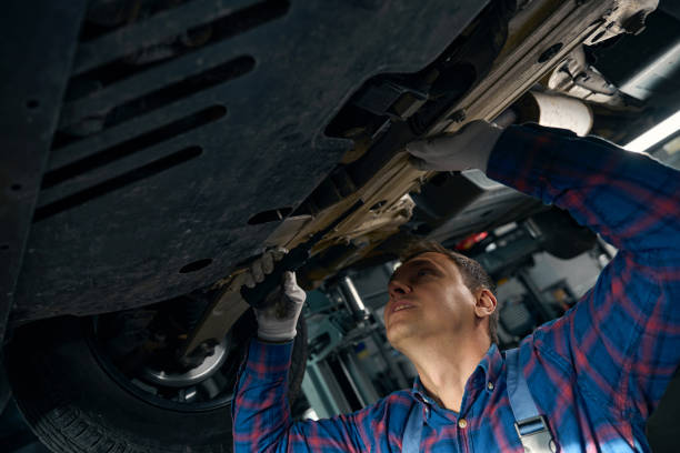 istock Young male looking at chassis of machine 2118289629