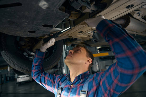 istock Young man looking at chassis of machine 2118289988
