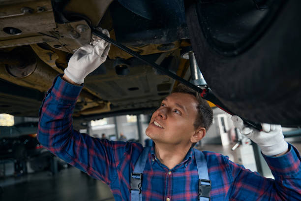 istock Male performing maintenance on chassis of machine 2118290138