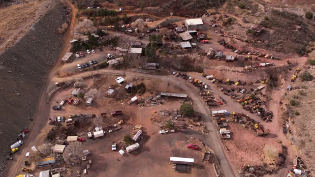 Drone Shot of Jerome Ghost Town, Rustic Buildings and Vehicles on Abandoned Mine