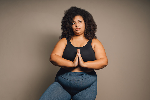 Plus size woman in meditation exercise