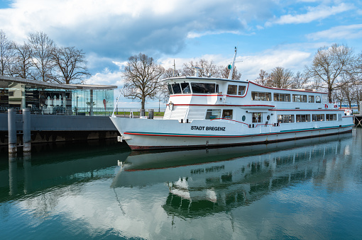 Bregenz, Austria - March 15, 2024: Tourist ship Stadt Bregenz - The town of Bregenz - sailing on Lake Constance, anchored in the home port of Bregenz