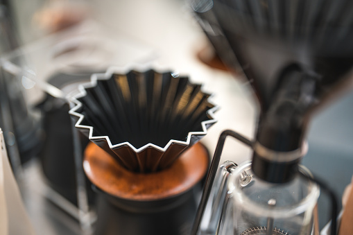 Uncover the secrets behind exceptional drip coffee making as the barista expertly wields essential tools at the bar counter, orchestrating a symphony of flavors that will delight even the most discerning coffee enthusiasts.
