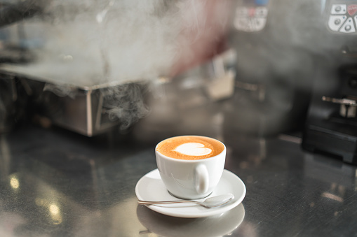 Allow yourself to be tempted by the irresistible allure of a cup of coffee placed enticingly on the bar counter.