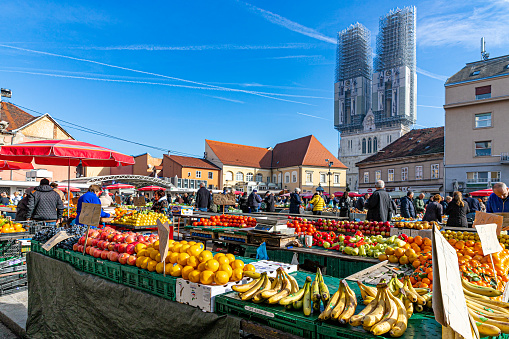 February 1st, 2024. Zagreb, Croatia.  Sales tables with fruits in the old center of the city and some random people.