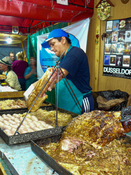 young man cooking arabic street food