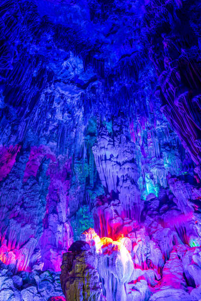 istock beautiful illuminated multicolored stalactites from karst Reed Flute cave 2118478330
