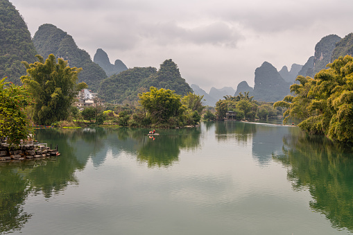 Landscape of Guilin, rural areas. Karst mountains, farmland and small villages. Located near Yangshuo, Guilin, Guangxi, China.