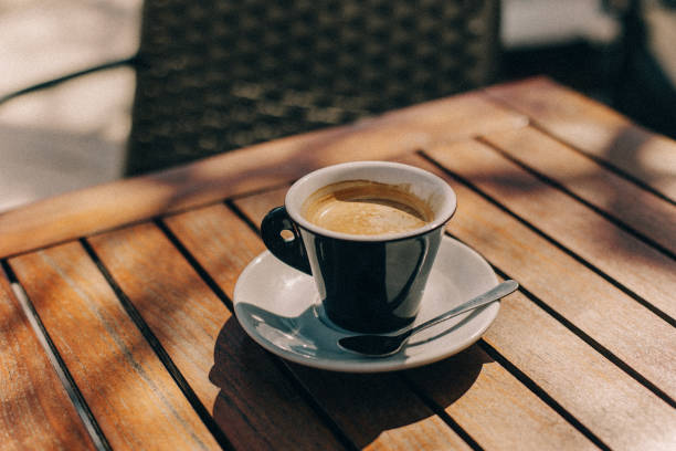 istock Cup of black coffee on a table in a street cafe. 2118511472