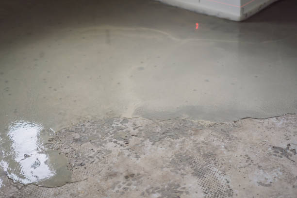 istock floor partially covering with self-levelling cement mortar 2118516801