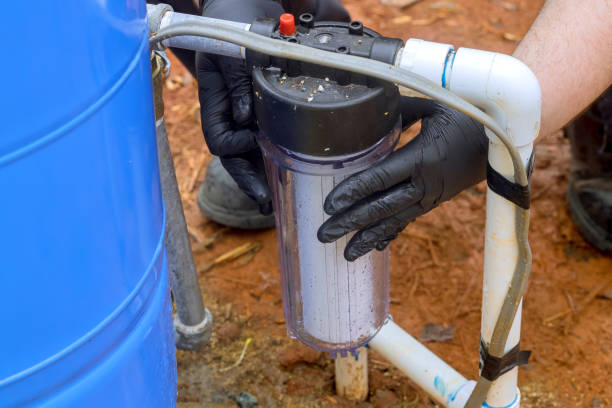 istock Maintenance service man installing water purification filter cartridge is being a replaced 2118522923