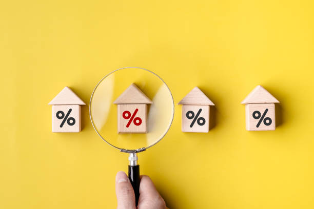 istock Women customer use magnifying glass finding to interest rate home is minimum, affordable alternative price, economic recession, reduce costs, mortgage home, financial and investment concepts. 2118531391