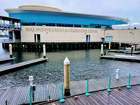 Norfolk, Virginia, USA - May 28, 2023: A sign identifies the Half Moone Cruise and Celebration Center, also known as the Norfolk Cruise Terminal, in downtown Norfolk.