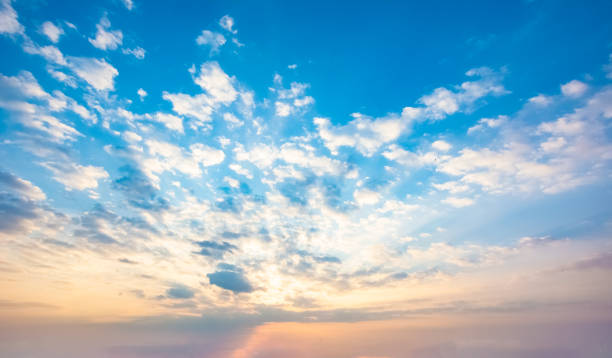 istock Cirrocumulus or altocumulus clouds at sunset. Frog eye view. 2118870222
