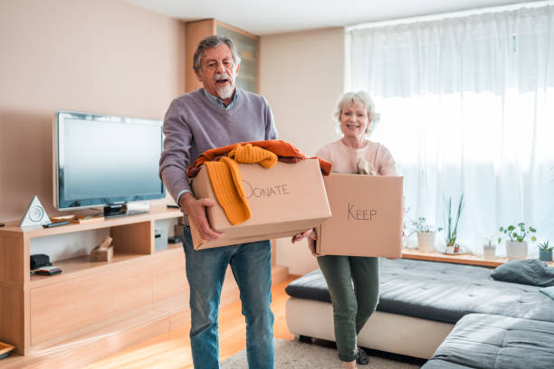 istock Senior Caucasian Couple Sorting Donations Indoors 2118900929